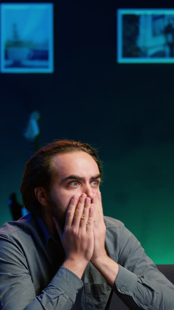 Vertical video Furious sports fan in disbelief during match broadcast after team fails to score