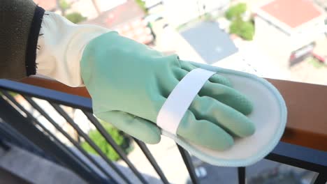 cleaning a balcony railing
