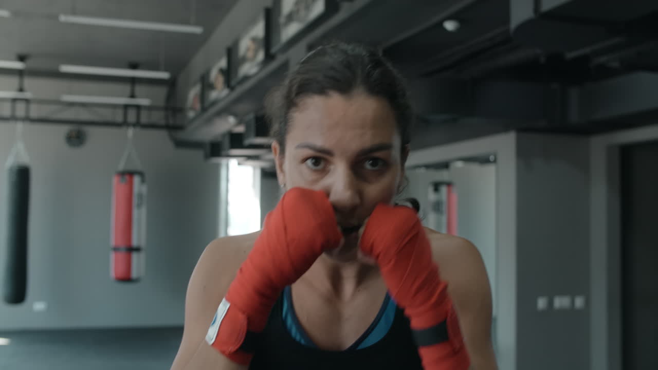 Female Boxer Training in Gym