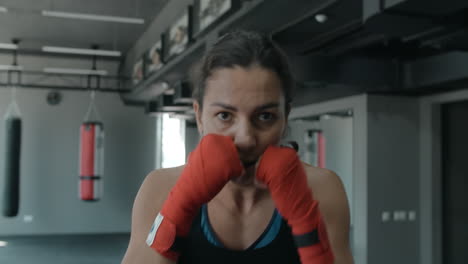female boxer training in gym