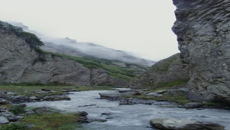 mountain valley with fog and river