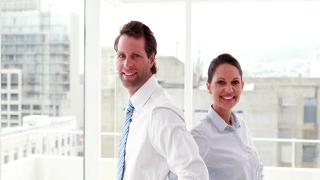 confident business colleagues smiling at camera
