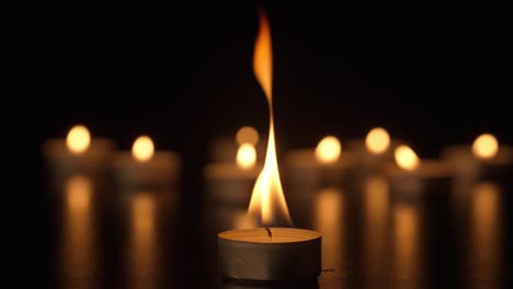 burning candles in darkness