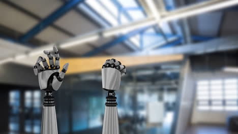 Robot-hands-and-blurred-industrial-background