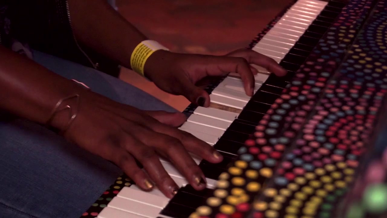 Post Millennial African American girl playing Piano in Atlanta,GA at Atlantic Station.