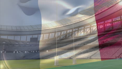flag blowing in front of a stadium