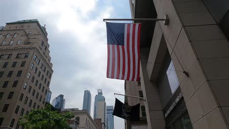 Waving-Flags-Hanging-On-The-Building-Facade-In