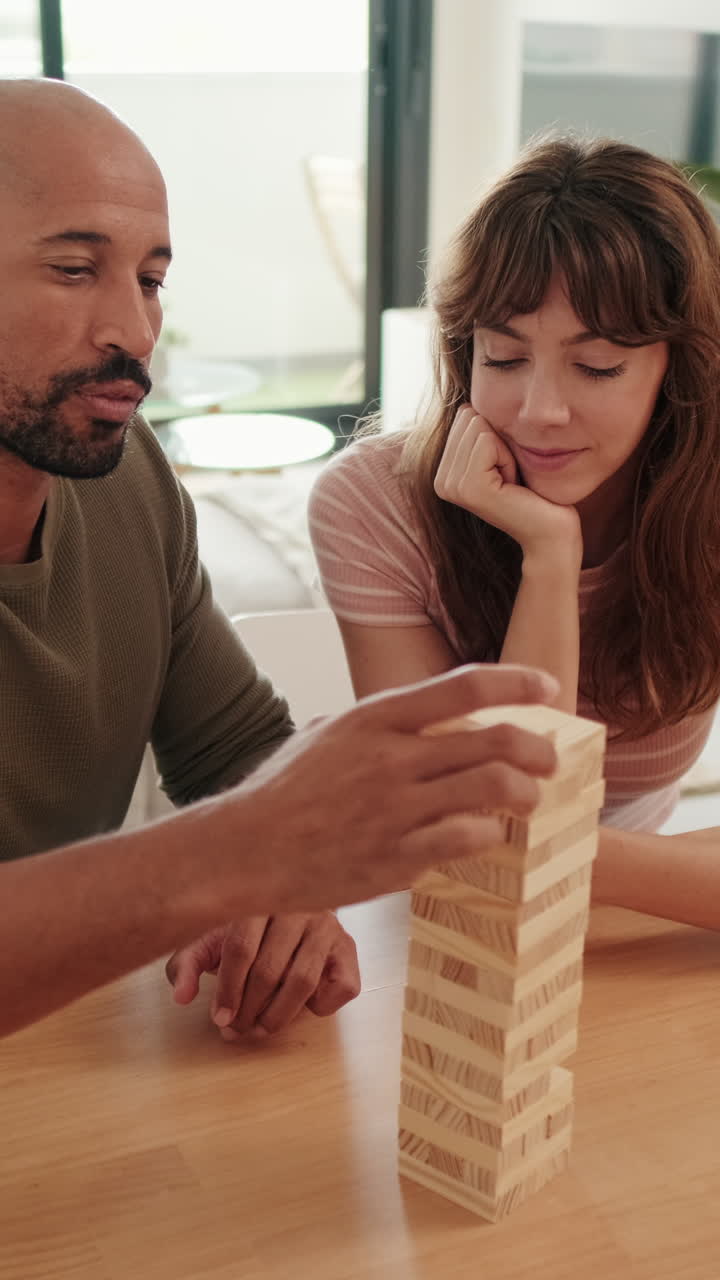 Couple Playing Jenga at Home