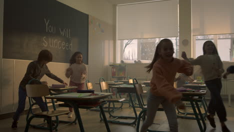 students learning in classroom . schoolboys and schoolgirls sitting at desks