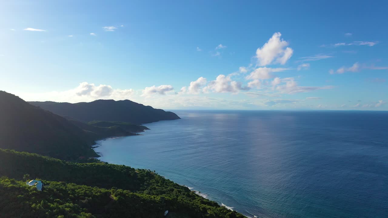Tucked into the coastal trees of St. Croix, USVI, a select few luxury homes enjoy sweeping ocean views and total privacy, all beneath a radiant midday sky over the Caribbean Sea