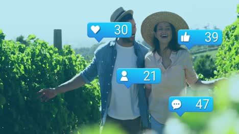 animation of media icons over caucasian couple walking