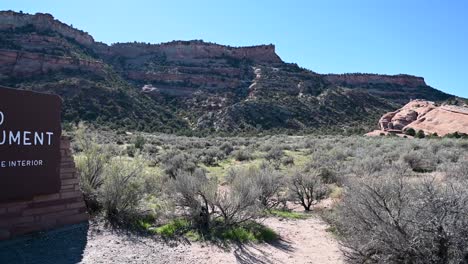 panning shot of the colorado national monument entrance sign