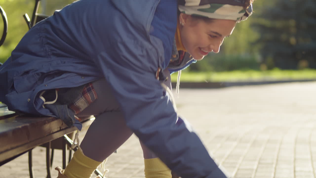 Joyous Woman Playing with Corgi in Park