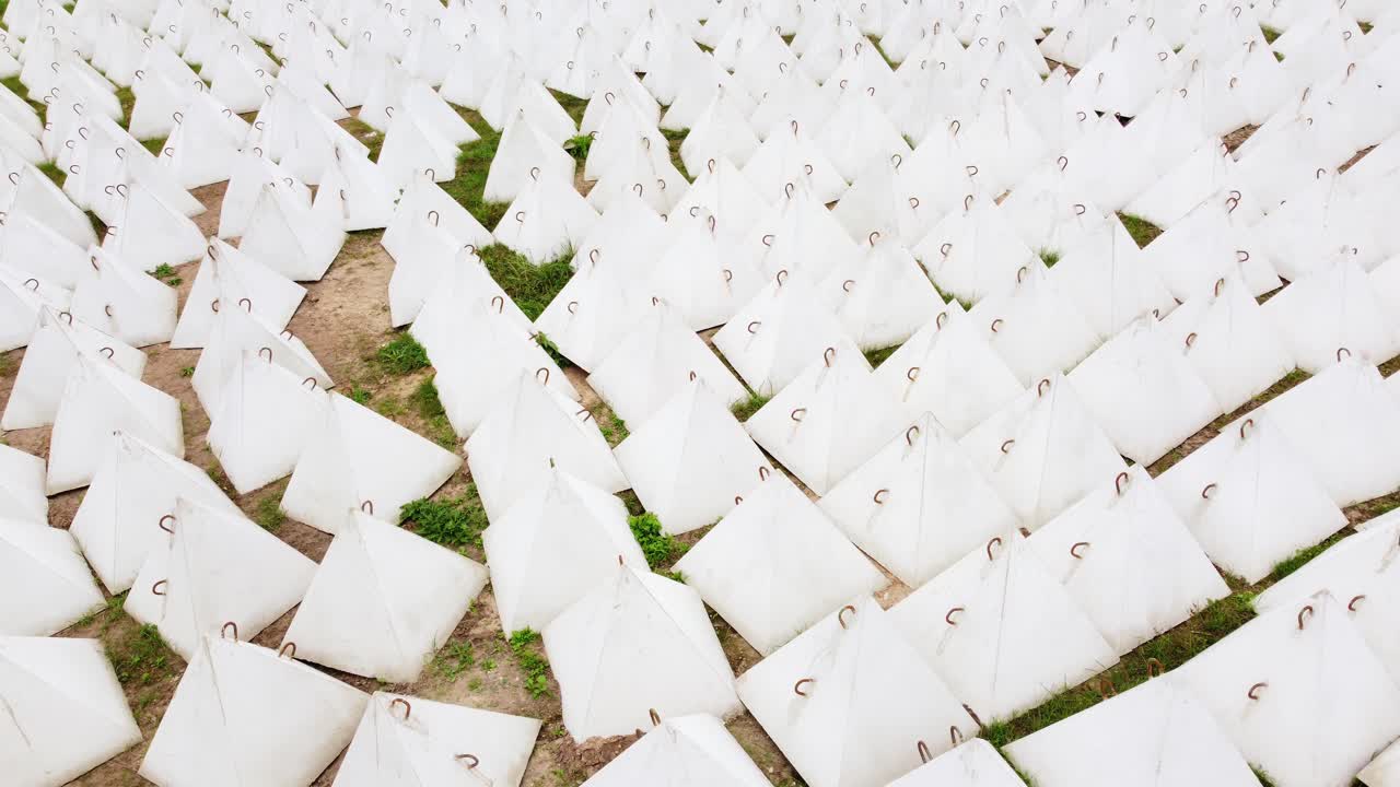 Aerial view lots of anti-tank Military dragon teeth defense mechanism fortification