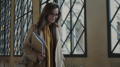 Female-student-walking-in-university-hallway