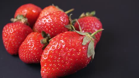 slow rotation of juicy strawberries. side view