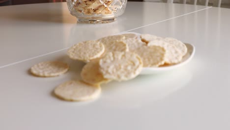 round cookies in white chocolate on a white table. sweet morning.