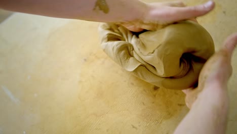 hands shaping clay