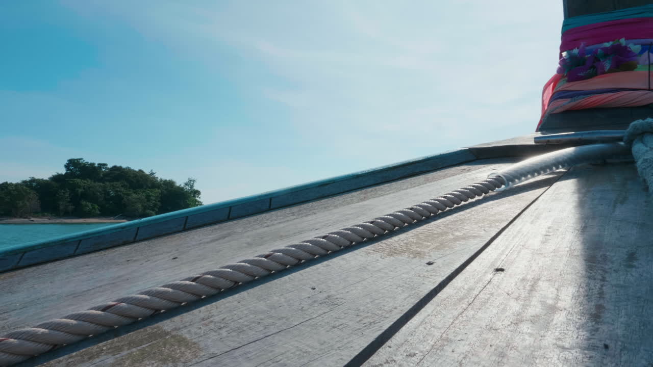 Wooden Boat Deck with Rope and Sky