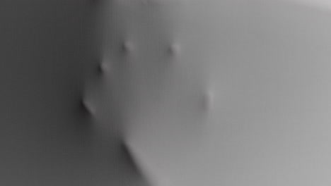 a scary face and hands appear from the white surface