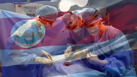 Animation-of-flag-of-costa-rica-waving-over-surgeons-in-operating-theatre