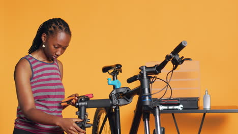 Mechanic-preparing-work-tools-before-starting-repairing-broken-bicycle