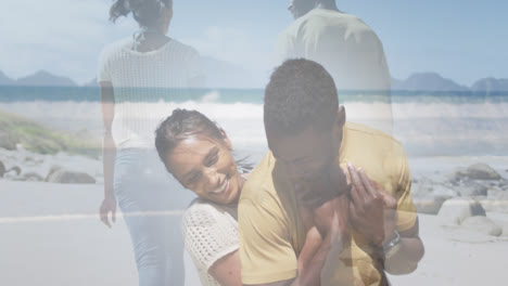 compuesto de una feliz pareja afroamericana abrazándose y caminando por la playa.