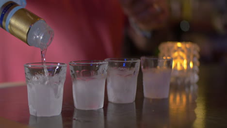 barman pouring alcohol