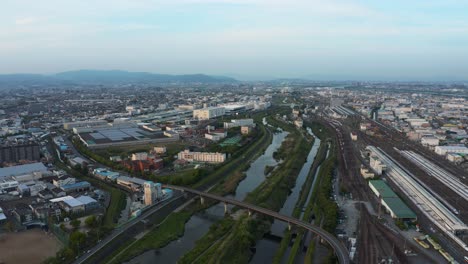 Kadoma-City-Aerial-View-of-Osaka,-Sunset-over-Kansai-Region-of-Japan