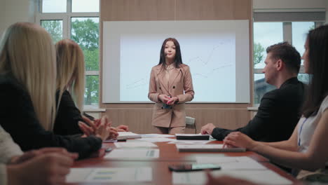 young-female-speaker-of-business-meeting-in-big-company-is-answering-on-questions-portrait