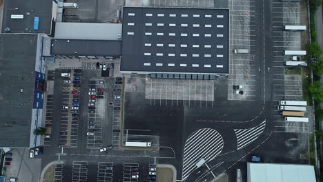 drone shot of parking lot in industrial estate