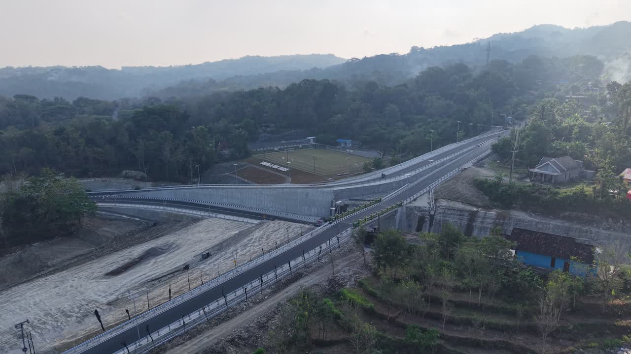 Aerial view, the new road that cuts through the hills from the city of Jogja to Gunungkidul passing the Banyunibo cliff climb