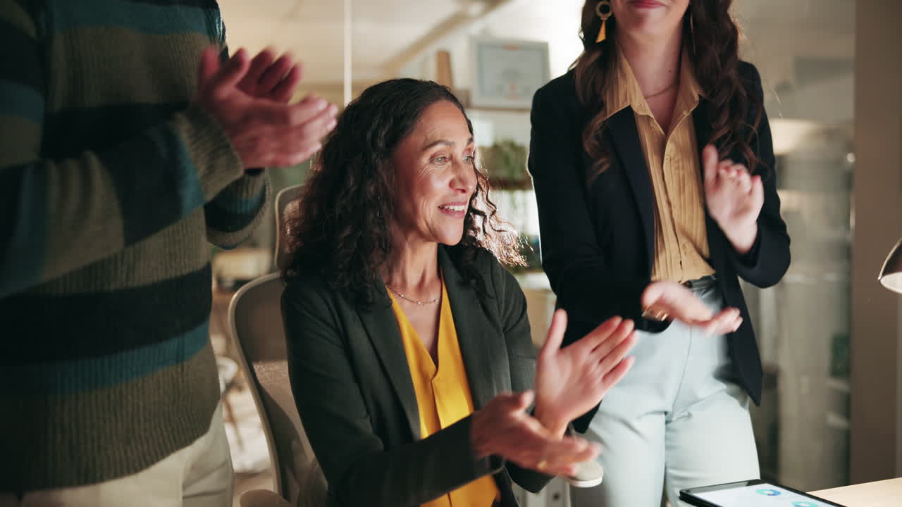 Business Colleagues Applaud a Colleague's Success