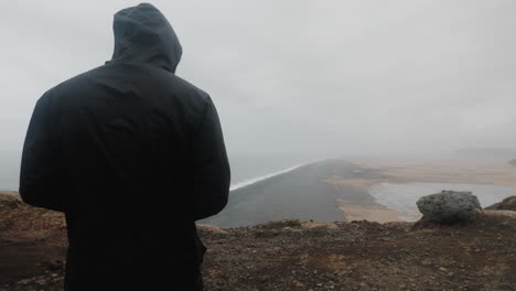 person contemplating a dramatic icelandic landscape