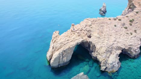 natural bridge and chair on the beach of tripiti in gavdos island