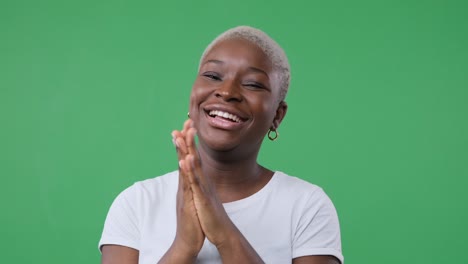 woman applauding and laughing over green screen