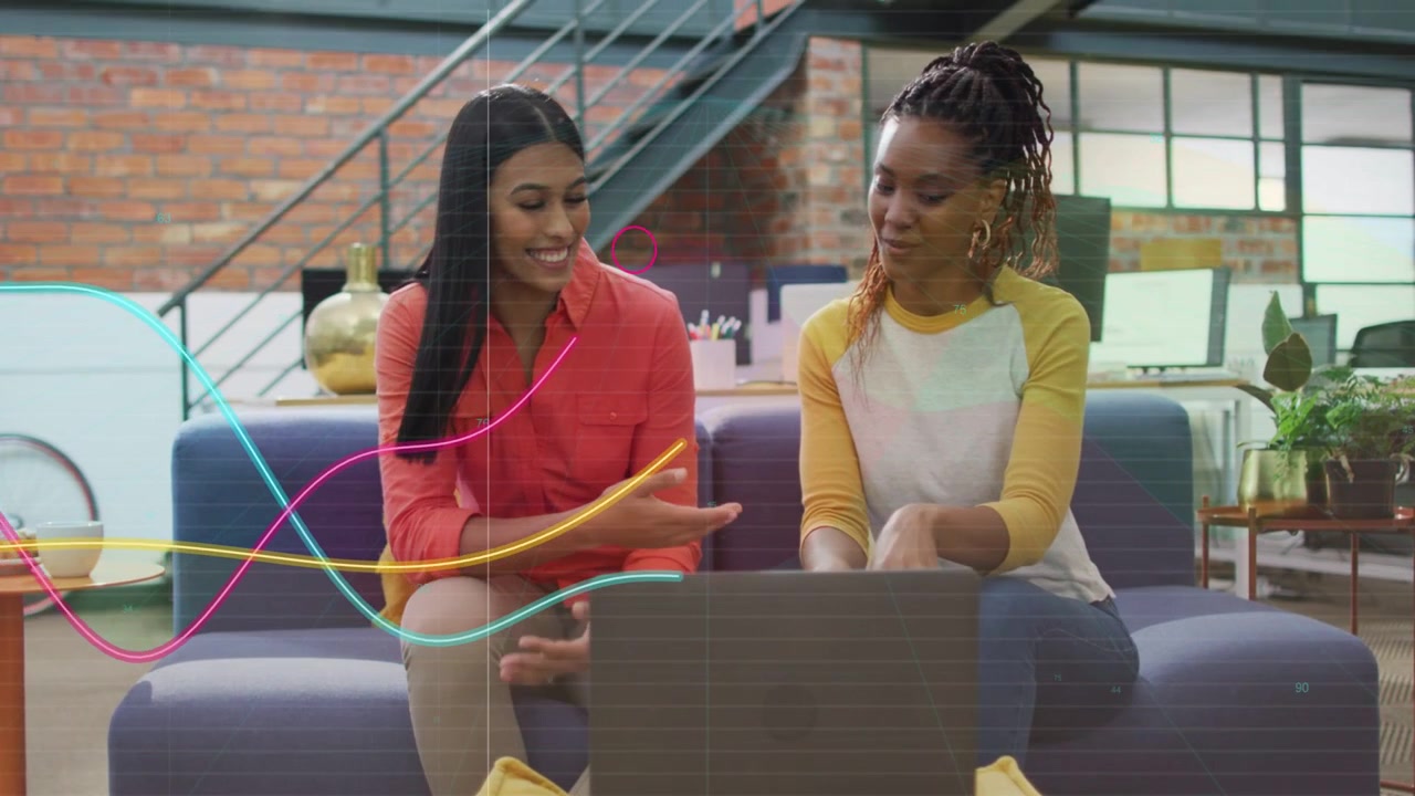 Two women talking business, left speaking while right tapping laptop making moving waves over frame