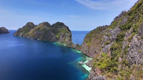 aerial viewpoint of the tranquil and stunning secret beach, matinlo island, philippines