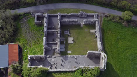 Dynamic-aerial-reveals-Annaghdown-Abbey-layout,-Galway