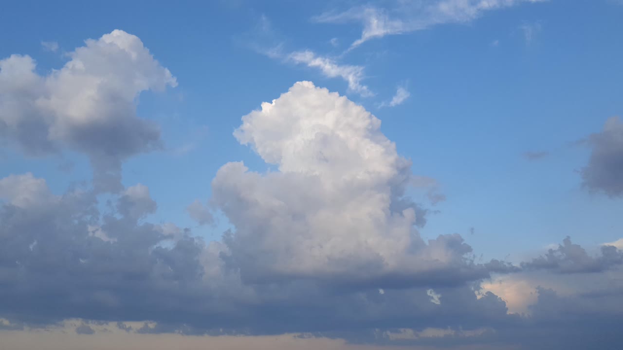 Beautiful epic cloudscape time lapse of summer thunderstorm clouds forming in 4k. Perfect as overlay, background of transition clip. Only minor noise reduction in davinci or neat image needed.