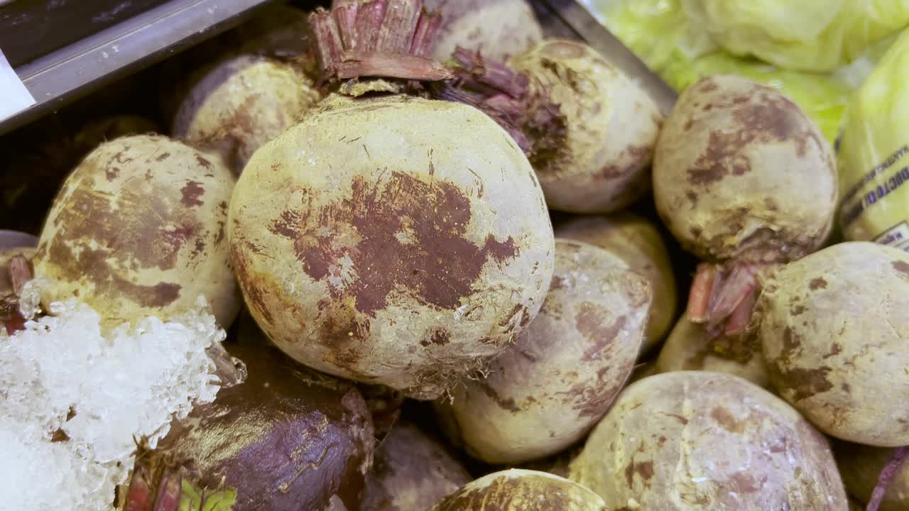 A vibrant close-up of fresh organic beetroot on display at a local farmers market, showcasing healthy, farm-to-table produce perfect for vegetarian and health-conscious lifestyles.