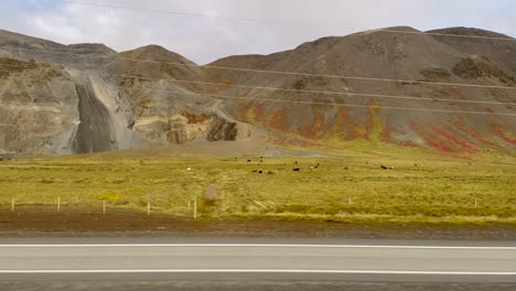 Colorful-Icelandic-mountains-captured-from-a-car,-vibrant-landscape