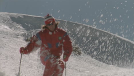 a man skies down a slope