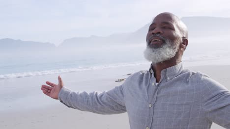 Mature-man-enjoying-time-outside-by-the-sea