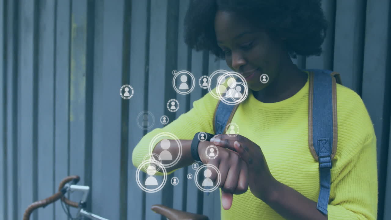 woman checking smartwatch beside metal fence, showing floating social media icons in tech scene