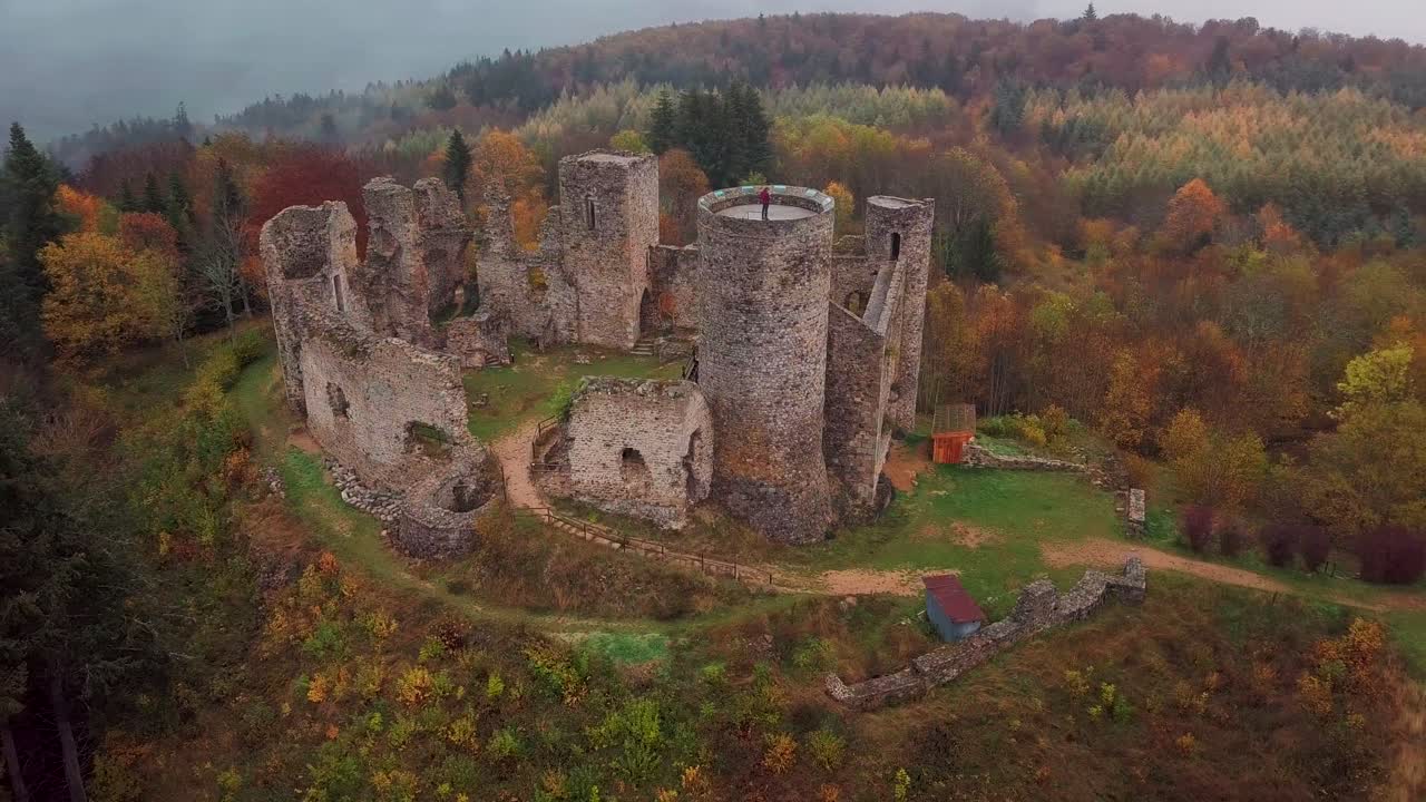 aerial shot around the Castle of the Cornes d'Urfé during fall on a foggy day in Champoly within the comte of Forez in the Loire departement, Rhone Alpes region, France