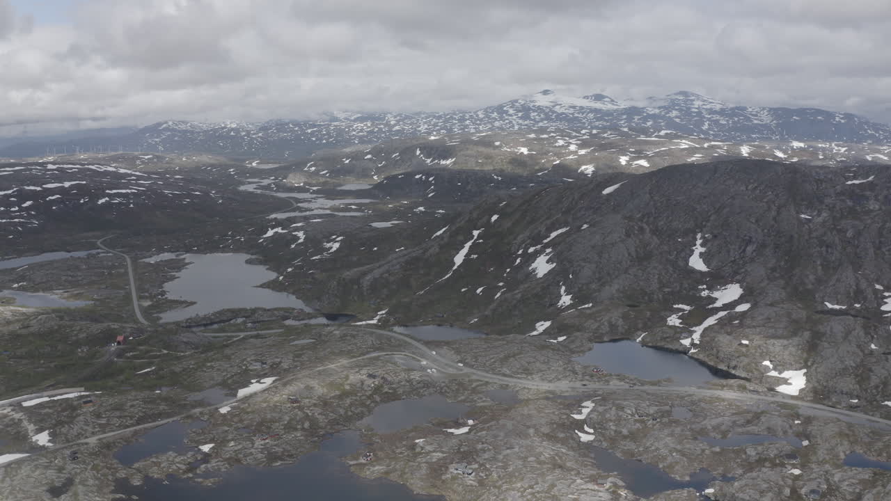 Aerial drone shot of the nordic rocky landscape of the town of Bjørnfjell at the Swedish border.
High view of the arctic tundra and vast wilderness.