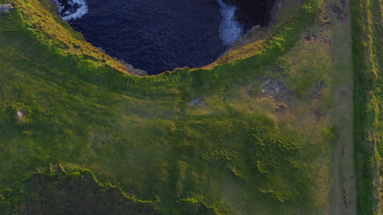 Aerial parallax reveals the Bridges of Ross from a unique perspective. Kilkee, Ireland
