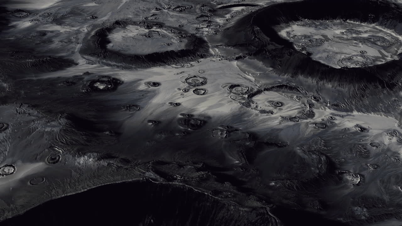 Detailed view of lunar craters and surface features under low light