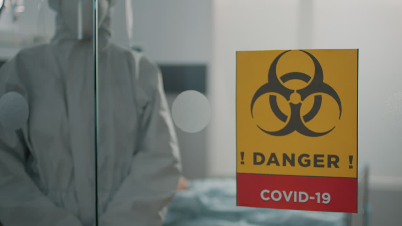 Portrait of medic wearing hazmat suit in lockdown zone